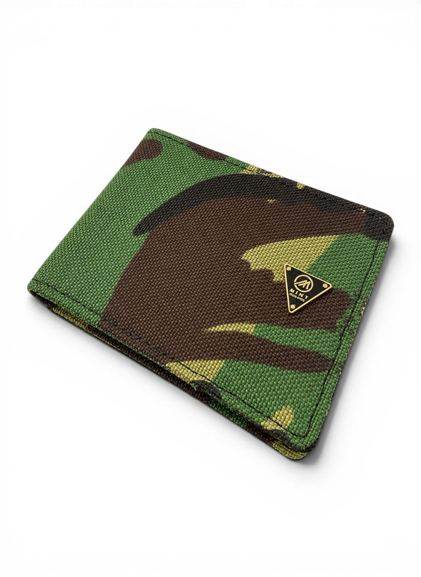 Camouflage-patterned wallet with a brand logo on a white background by Mint Worldwide.