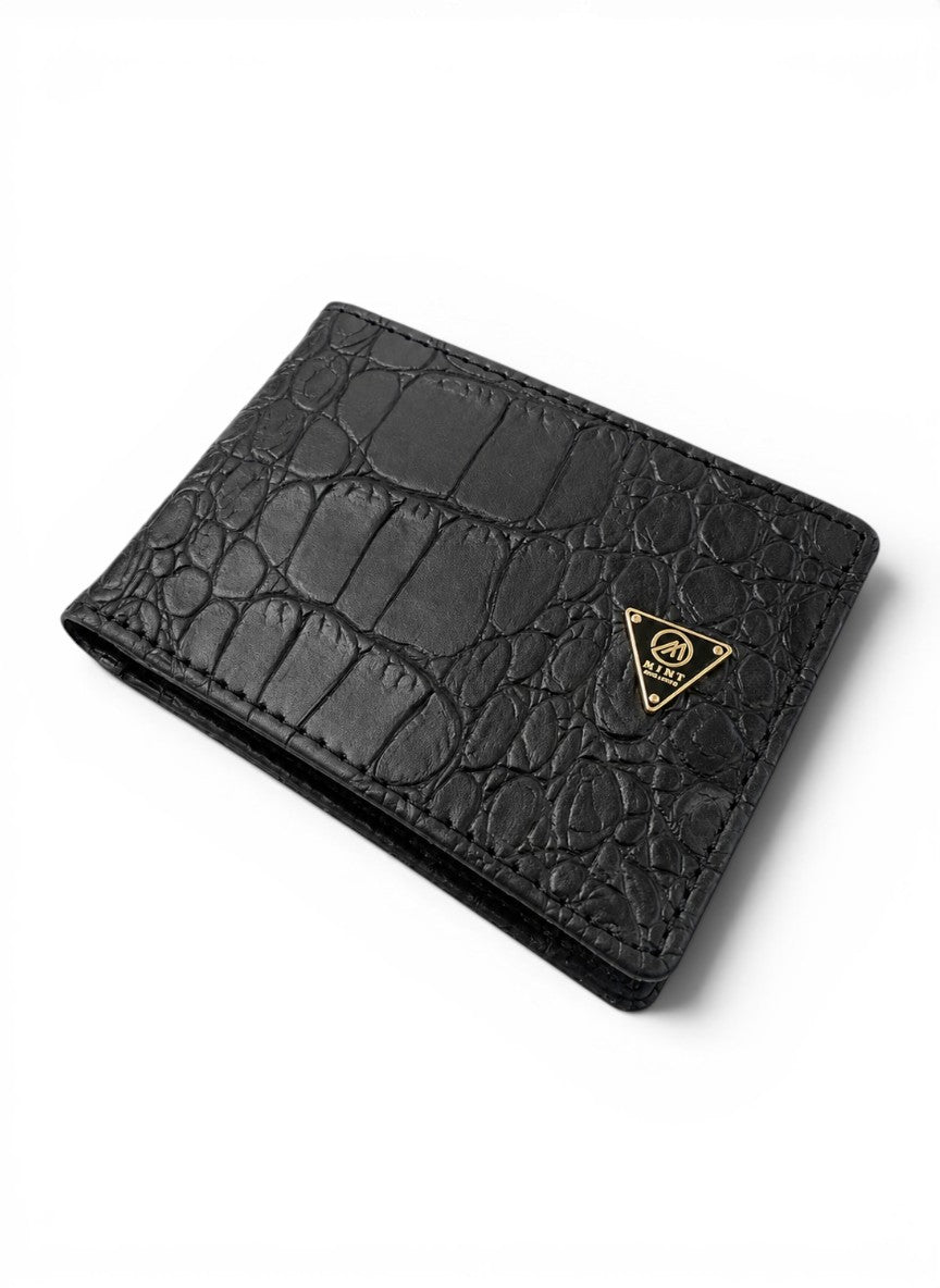 Black crocodile-patterned wallet with a gold logo on a white background
