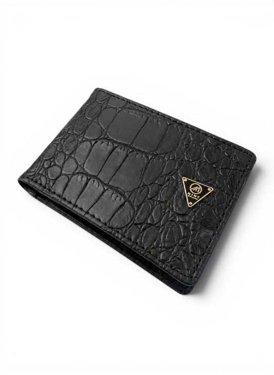 Black crocodile-patterned wallet with a gold logo on a white background