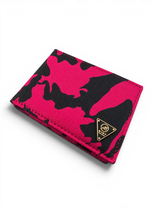 Pink and black camouflage wallet with a brand logo on a white background by Mint Worldwide.