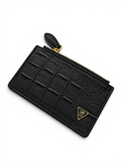 Black textured wallet with gold zipper and logo on a white background by Mint  Worldwide.
