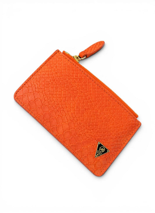 Orange textured wallet with a brand logo on a white background by Mint Worldwide.
