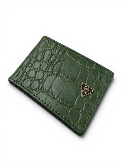 Green crocodile-textured wallet with a brand logo on a white background by Mint Worldwide.