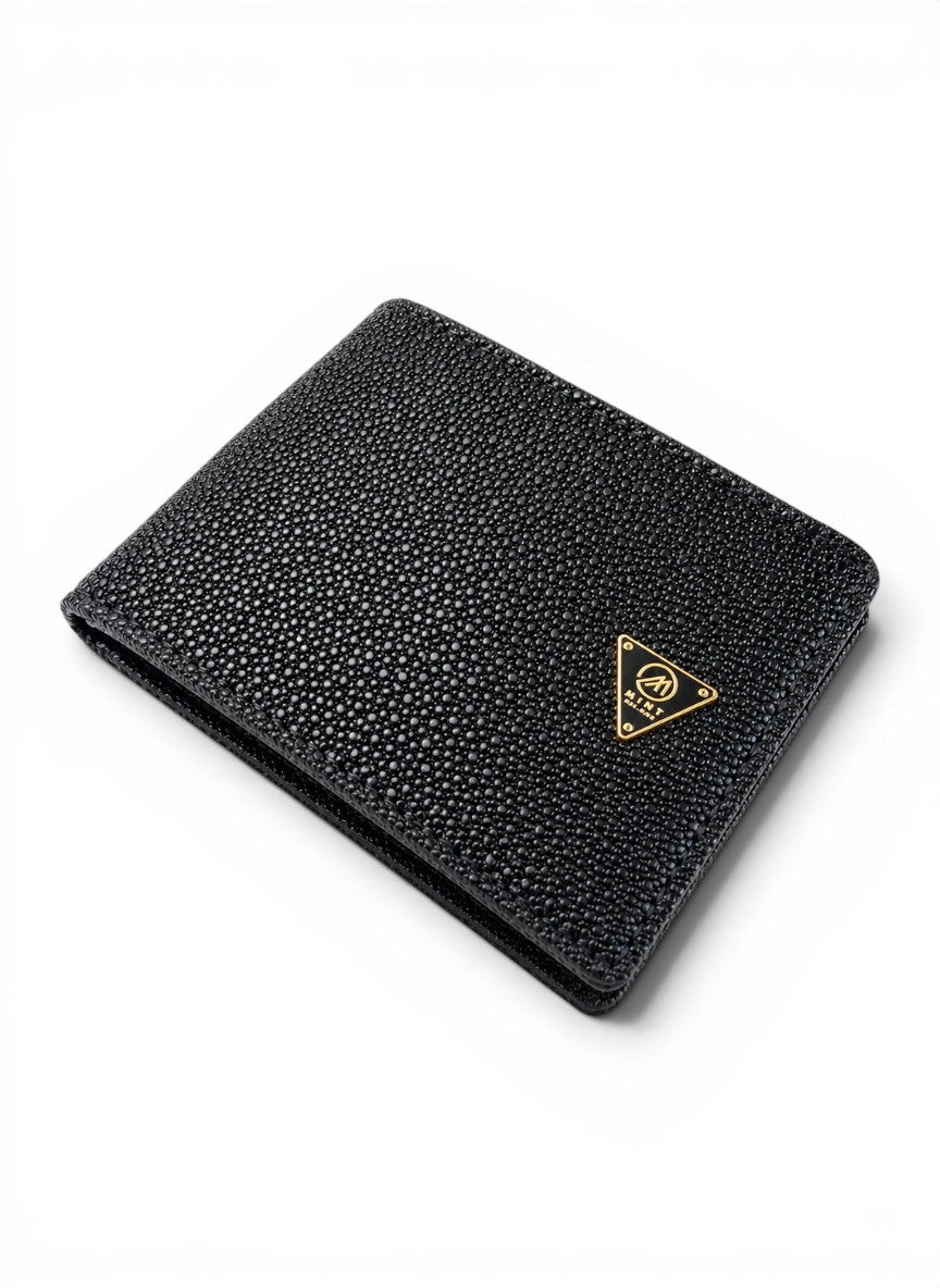 Black textured wallet with a logo on a white background by Mint Worldwide.