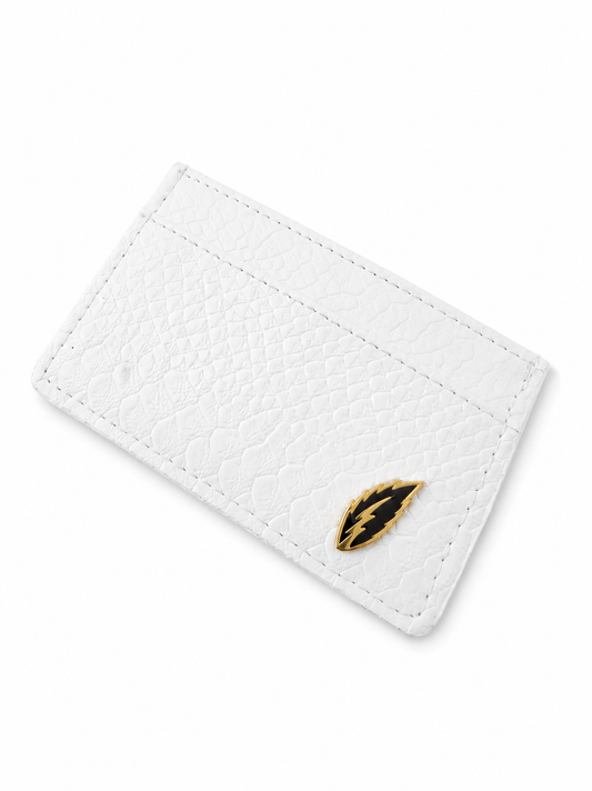 White cardholder with a gold feather emblem on a white background By Mint Worldwide.