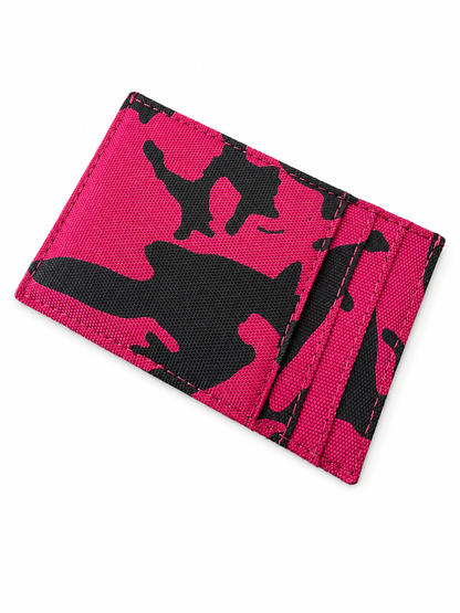 Pink and black camouflage wallet on a white background By Mint Worldwide.